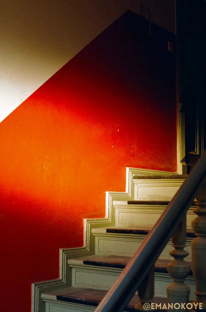 Stairs with orange wall shot on Kodak Portra 400 35mm
