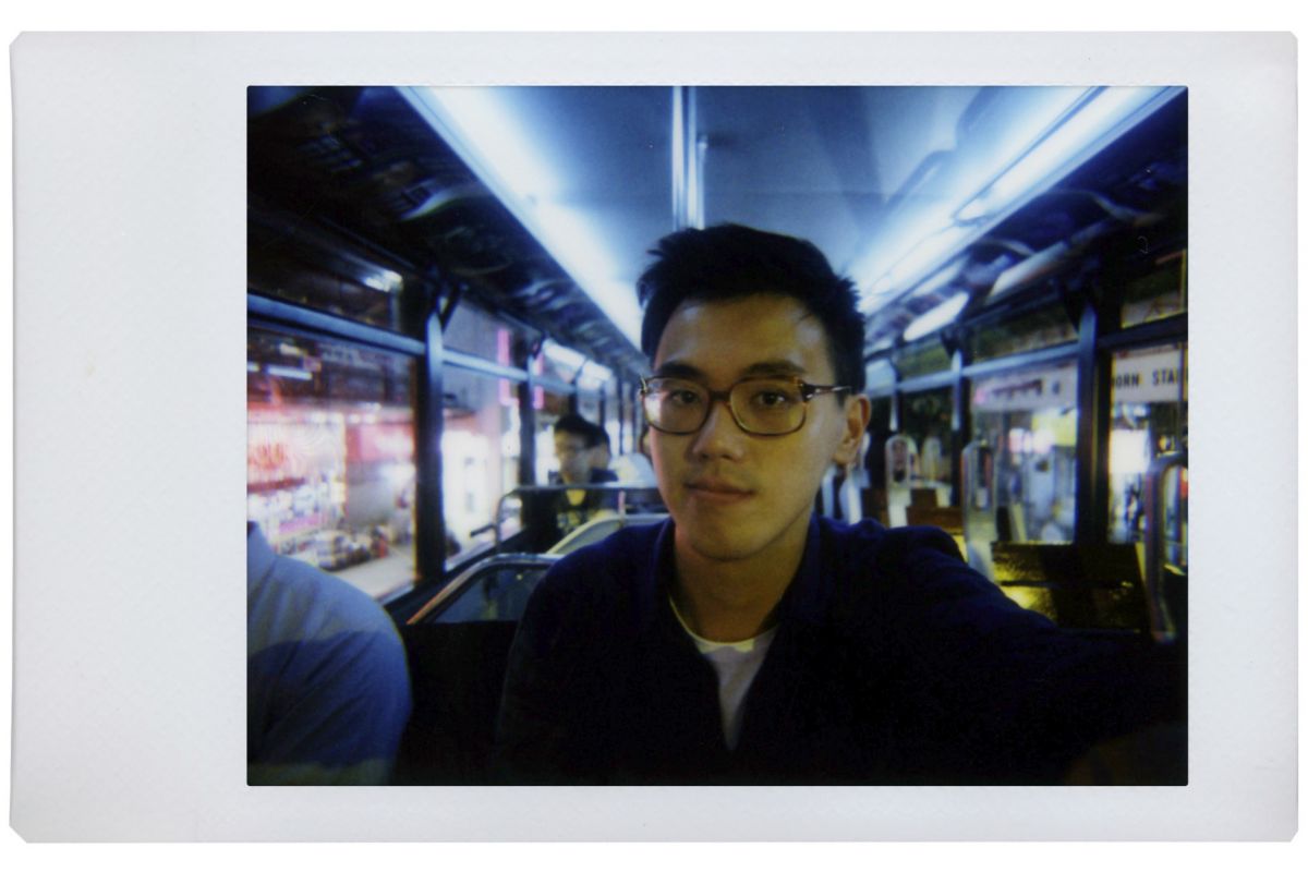 lomo instant mini film picture of a young man with glasses on fujifilm instax mini film