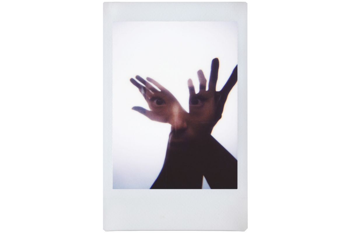 double exposure on a lomo instant mini of a lady and arms on instax fujifilm film